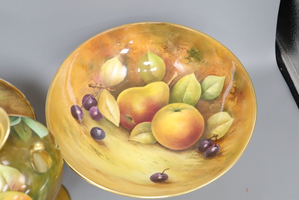 Keith Hancock for Coalport: a fruit-decorated bowl, diameter 26.5cm and two other pieces